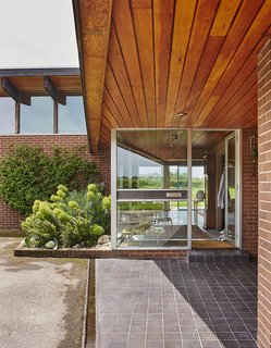 Quirky 1970s House in the English Countryside Showcases an Amazing Modern Furniture Collection - Photo 3 of 18 - The house is located on a 25-acre site. It sat unsold on the property for two years before the couple discovered it.