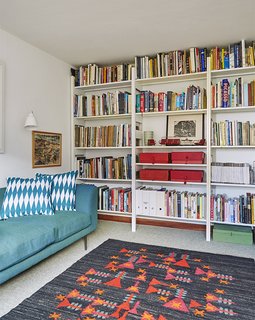 Quirky 1970s House in the English Countryside Showcases an Amazing Modern Furniture Collection - Photo 11 of 18 - A pressed-steel Parallel shelving system by Terence Woodgate holds books and mementos.