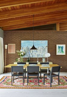 Quirky 1970s House in the English Countryside Showcases an Amazing Modern Furniture Collection - Photo 12 of 18 - The dining room features a Glo-Ball T table lamp by Jasper Morrison.