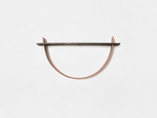 Crafted from a process called steam-bending, the curved wooden pieces are heated in a steam box, then formed into a shape.