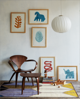 A Cherner Chair Retrospective - Photo 22 of 23 - The Menagerie Collection is a series of prints that depict animals and flora in a range of soft, yet vibrant colors. Although compositionally simple, each print is comprised of several parts—the graphic is screen printed on 140 lb. arches watercolor paper, after which McGinnis fills the colored print with a hand-drawn line sketch. From there, the 100 percent cotton paper is mounted and framed in an ash wood frame. Shown: Yellow Leaf, Blue Horse, Blue Fern, Red Snake, Blue Elephant.Also pictured: Cherner Lounge Arm Chair, Nelson Bubble Lamp Criss Cross Ball Pendant, and Shapes Rug.