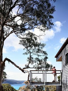 A Breezy Modern Beach House Sits Among the Trees in Australia - Photo 8 of 8 - The cantilevered deck juts out from the home. "You really feel like you’re floating," Harnkess says.