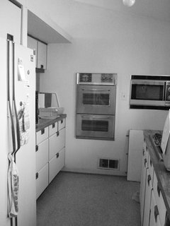 Modern Kitchen Renovation with Mid-Century Roots - Photo 1 of 6 - The original kitchen in the 1950 home was cramped and dingy, forcing architect Janet Bloomberg to reimagine the space and open it up to the rest of the living area.