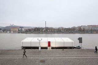 Floating Prefab Concept Rethinks the Houseboat - Photo 5 of 7 - A C-Frame catamaran currently docked in Prague’s Holesovice neighborhood, Port X is a buoyant dwelling for modular, modern living. Prague’s Atelier SAD finished the concept last fall, collaborating with a company that develops sailing boats to fabricate its curved exterior.