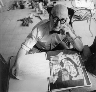 Le Corbusier: The Most Stylish Architect in History - Photo 4 of 7 - Roll 'em if you got 'em. Corbu shows that even when working hard you can still look effortless.