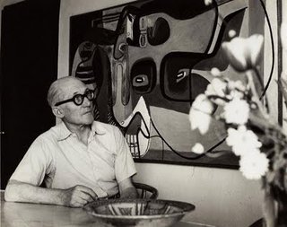 Le Corbusier: The Most Stylish Architect in History - Photo 6 of 7 - Casual duds here, and perfect proof that one bold accessory (can't get over those glasses) elevates a pretty basic look.