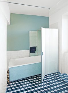 10 Ideas For Designing With a Modern Bathtub - Photo 7 of 10 - For the bathroom, Reckendorfer wanted a shower for daily use, but opted to keep a 1950s bathtub that she discovered in her basement. "I studied graphic design and photography, so visual things are so important to me," she says. "I love sleek, light-filled Scandinavian designs, but I also love flea markets and pieces with history."