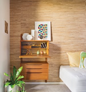 A Good Reed<br><br>The most changed area of the home is the small guest room–office, where Neely, who works from home, removed the closet doors and added a grass-cloth wall treatment to distinguish it from the rest of the house’s decor. "Many of the Eichlers originally had grass cloth as a covering on the sliding closet doors," he says. "The guest room–office is the only other room that can be seen from the public areas across the atrium, and I wanted this wall to add visual interest."