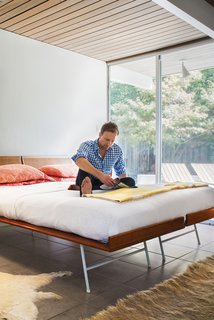 Full Nelson<br><br>The bed in the master bedroom is actually two single 1950s George Nelson Thin Edge beds--made from birch, enameled metal, and cane--that Neely bought at auction at the John Toomey Gallery in Oak Park, Illinois. "I love the contrast of the white wall with the wood and woven material," says Neely, who likes to keep the beding simple--often a paisley from Ralph Lauren--so as not to detract from the bed's strong lines.