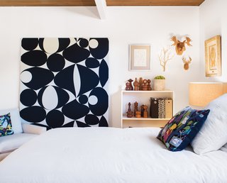 Graphic Novelty<br><br>A textile designed in 1998 by Scandinavian designer Carl Johan Hane serves as an artful accent to the guest bedroom. Neely found the patters--Mobile, created for the Swedish textile company Kinnasand--as Skandium, in London. "I wasn't sure how best to display it. Then a painter friend of mine suggested I have it stretched across a wooden frame, just like artists do with raw canvas," he says.