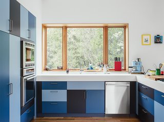 Kirkpatrick also constructed the laminate kitchen cabinets topped with Corian in Glacier White. Appliances are by Thermador; the satin nickel door hardware is by Mockett.