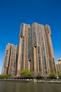 The monolithic River Park Towers by Davis, Brody & Associates loom above the calm waters of Upper Manhattan.