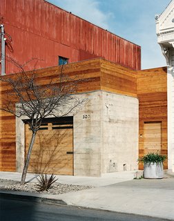 Abandoned Industrial Compound Becomes a Modern Home Base - Photo 8 of 11 - The front entrance is located next to the garage.
