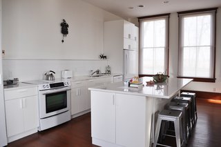 Living in a 1912 Schoolhouse - Photo 3 of 4 - The updated kitchen boasts new cabinetry and appliances.