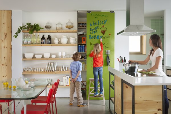 IdeaPaint recruited their onsite artist, Derek Cascio, to create a special wall for kids to color and scribble on in the Modern Family Pavilion.