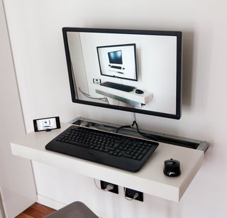 A Look at Space Saving Furniture - Photo 4 of 5 - When other space is limited, don’t forget to the use the walls. In the kitchen, save countertop and cabinet space by using a magnetic spice rack. No room for a full desk in your office? Purchase a laptop cabinet or computer station that can hang on the wall.