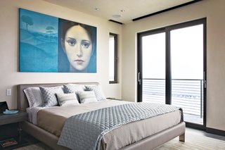 In the master bedroom, Azul Giorgione by Alberto Gálvez hangs above a locally manufactured bed from Soluzioni. The sheets, pillow cases and blanket are from Restoration Hardware; the decorative pillows and quilted coverlet are from Bed, Bath, and Beyond. <br><br>To learn more about the Cranston Residence project and its players, please visit www.3palmsproject.com
