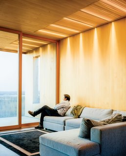 The living room features a sofa by Dellarobbia.