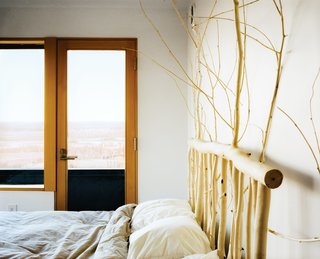 Buser designed and made the headboard in the master bedroom from local aspens.