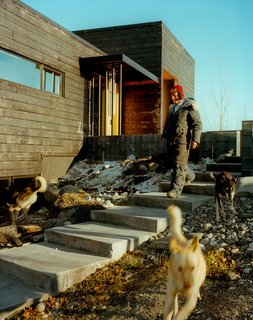 Perched on top of a hill, the house is accessed by a long staircase that runs up to the exterior courtyard. The dogs, naturally, take their own route.