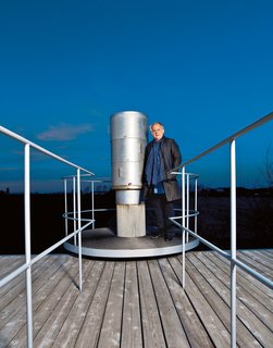 On the roof, Geller takes in the night sky with his telescope.