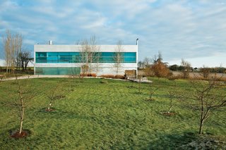The long rectangular Field House abuts what Burnette describes as a "memory orchard," a grove of fruit trees just beyond the deck that was planted in honor of Geller’s late father.