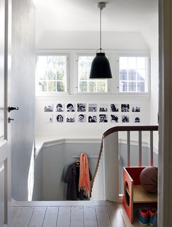 A Cramped Attic Became a Sunny Dining Room in this Renovation of a Copenhagen Tudor - Photo 1 of 12 - In the Denmark home of designer Eglantine Charrier, original 1920s windows and moldings meet modern accessories like a black Caravaggio pendant lamp by Cecilie Manz for Lightyears.