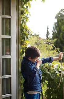 A Cramped Attic Became a Sunny Dining Room in this Renovation of a Copenhagen Tudor - Photo 10 of 12 - Vines growing off a small balcony connect the indoor space with the lush garden.