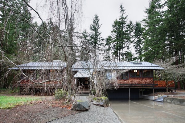 nestled in a grove of douglas fir trees the house stands on series of wooden - Japanese Inspired Architecture nestled in a grove of douglas fir trees the house stands on series of wooden - Japanese Inspired Architecture