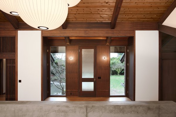 The building’s character is defined by the texture and color of its exposed wood. The clients wished to maintain this unique design feature and the architects worked extensively to repair and maintain the original ebony hues. The oak floors were refinished. The dark brown beams and columns are stained fir; they only required repairs on the exterior. The ceiling is cedar. Photo 2 of Zema Redux modern home