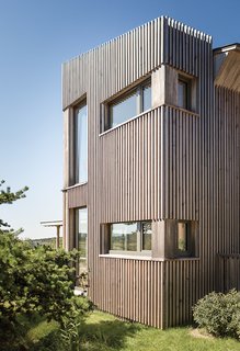 An Artist Builds a Wooden Home That Lets Nature Be the Boss - Photo 2 of 7 - The exterior is clad in eastern hemlock. "It’s local, it’s native, and it’s actually got a good bit of resistance," Winkelman says of the material, "and we could mill it to a unique dimension."