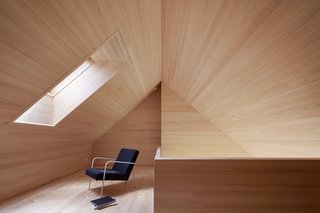 A Simple Gabled House Features an Intricate Latticework Shell - Photo 7 of 10 - A skylight floods the loft space with daylight and offers views of the stars at night.