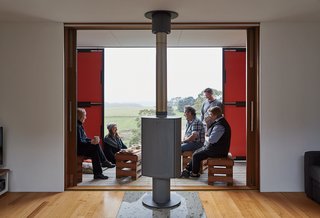 An Off-the-Grid Prefab that Combines Open Plan Living with Rugged Durability - Photo 4 of 10 - The two building skins form a veranda in-between, where Burns and his partner, Tania Soghomonian, often entertain guests.