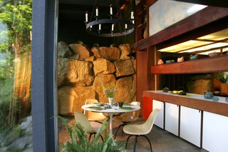 Wright would change the color scheme of his interiors, swapping out the white kitchen panels seen here, depending on the season and the landscape's colors.