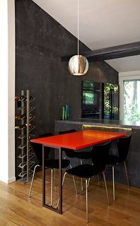 Modern Kitchen Renovation with Mid-Century Roots - Photo 4 of 6 - A new dining table, made from a leftover acrylic slab by 3form, sits on just the other side of the kitchen workstation. Photo by: Greg Powers