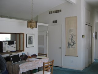 Modern Kitchen Renovation with Mid-Century Roots - Photo 5 of 6 - Here's another before look at the kitchen and dining space. What's most amazing is that Bloomberg didn't move any rooms or alter the footprint of the house during her renovation. She merely modernized the existing layout and refreshed the furniture and fixtures.