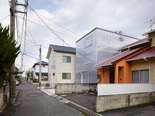 The milky-white, one-and-a-half-inch thick polycarbonate plastic panels keep its inhabitants from being seen from the outside (unless they stand right up against the wall). From inside, urban surroundings become a pleasantly blurry backdrop.
