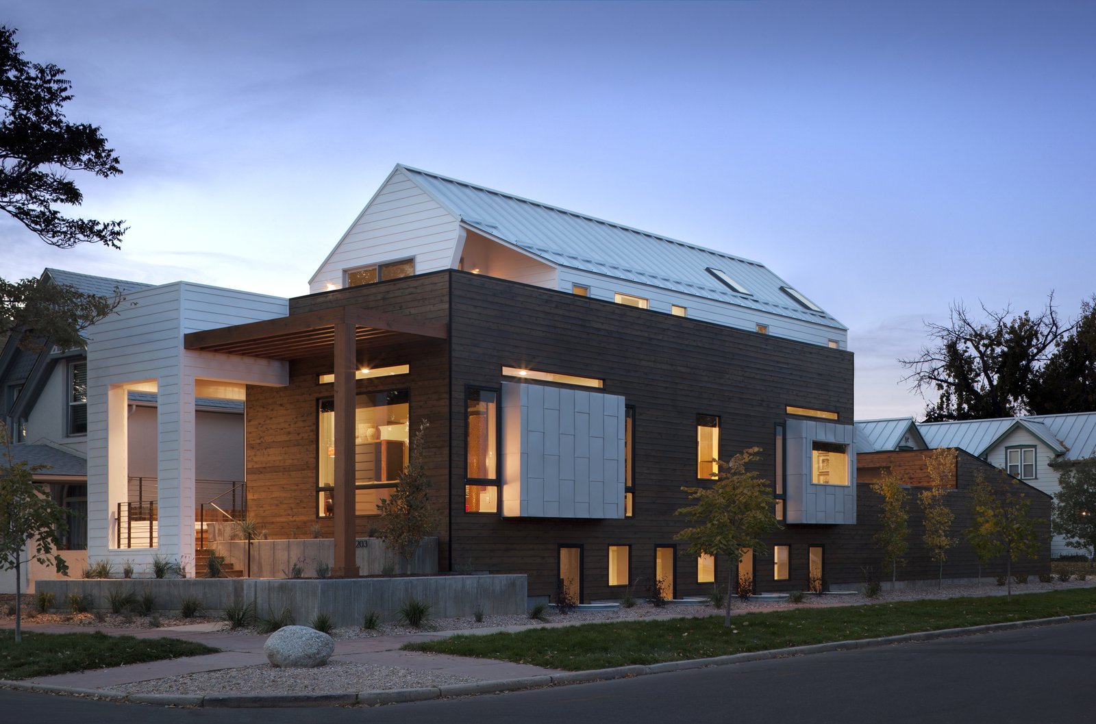 Apart from a “generous” master bedroom, Mitchell says that the couple also wanted a rooftop deck to see views of downtown Denver. A sloped roof kept the building up to code, and the outdoor deck “was achieved by shifting the upper volume backwards from the front of the house,” he says.