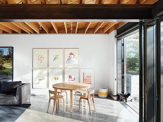 An Alvar Aalto table is surrounded by a quartet of the designer’s Chair 65.