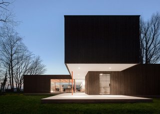 This Blackened Timber House Triumphantly Emerges After a Fire - Photo 1 of 6 - Using prefabricated elements, Bas van Bolderen Architectuur and Studio Puisto Architects were able to complete the dwelling in just eight months so the couple’s lives could return to normal. Wall elements were constructed in Germany, then transported to the Netherlands, where the house was erected in just one week.
