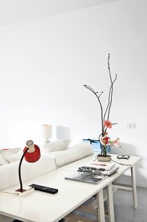 The master bedroom’s red light is a vintage piece from the 1950s.
