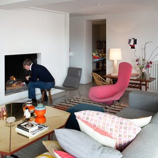 A Cheerful and Modern Living Room in Belgium - Photo 1 of 2 - Renaud de Poorter lights a fire in his Bellum, Belgium, residence.
