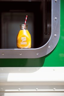 The window is outlined with a stainless steel portal that widens at the bottom to become a continuous transaction counter. <br><br>Photo by: Meg Haywood-Sullivan