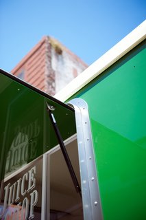 Detail of gas shock that assist in the opening of window/awning.<br><br>Photo by: Meg Haywood-Sullivan