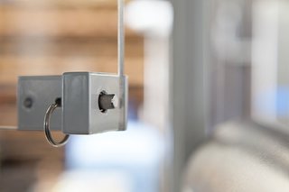 Detail of custom latch for the windows inside service window.<br><br>Photo by: Markio Reed
