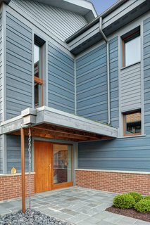 Sustainable Living: Chicago's First Certified Passive House - Photo 2 of 8 - The entry sequence was designed to allow accessible entry, creating a sense of shelter and highlighting the thickness of the super-insulated ICF walls.