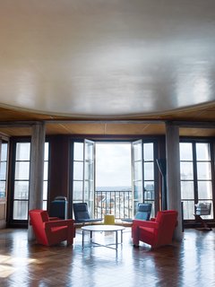Long before he moved into the historic building, Dutch architect Felix Claus admired 51 rue Raynouard, an apartment block in the Passy district of Paris designed and built in 1932 by Auguste Perret. In 2006, Dutch architect Felix Claus—director of Claus en Kaan Architecten, one of the Netherlands’ top architectural practices—finally got inside Perret’s apartment. In the atrium are two Low Pad chairs by Jasper Morrison and a Still coffee table by Foster + Partners. Photo by Hotze Eisma.