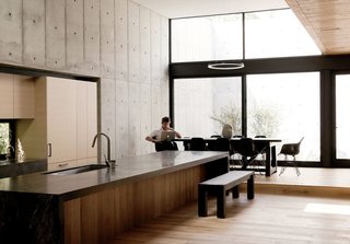 A Texas Couple Builds Their Cast-In-Place Concrete Dream Home - Photo 2 of 17 - It took six weeks to build the formwork for the poured-concrete walls that make up the first floor. Inthe kitchen the floors are raw European white oak, the countertops are Capolavoro granite with a leather finish by Antolini, and the natural oak cabinets are by Varenna.