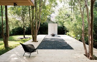 A Texas Couple Builds Their Cast-In-Place Concrete Dream Home - Photo 4 of 17 - The metal Grillage chair on the deck is by François Azambourg for Ligne Roset.