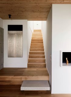 A Texas Couple Builds Their Cast-In-Place Concrete Dream Home - Photo 10 of 17 - White-oak stairs connect the first-floor living spaces with the upstairs sleeping areas.